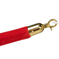 Nahaufnahme eines roten, samtbezogenen Absperrseils mit glänzendem, goldfarbenem Endstück und Haken.